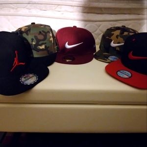 4 brand new nike hats and 2 jordans